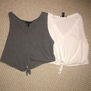 Two cropped tie in front tanks